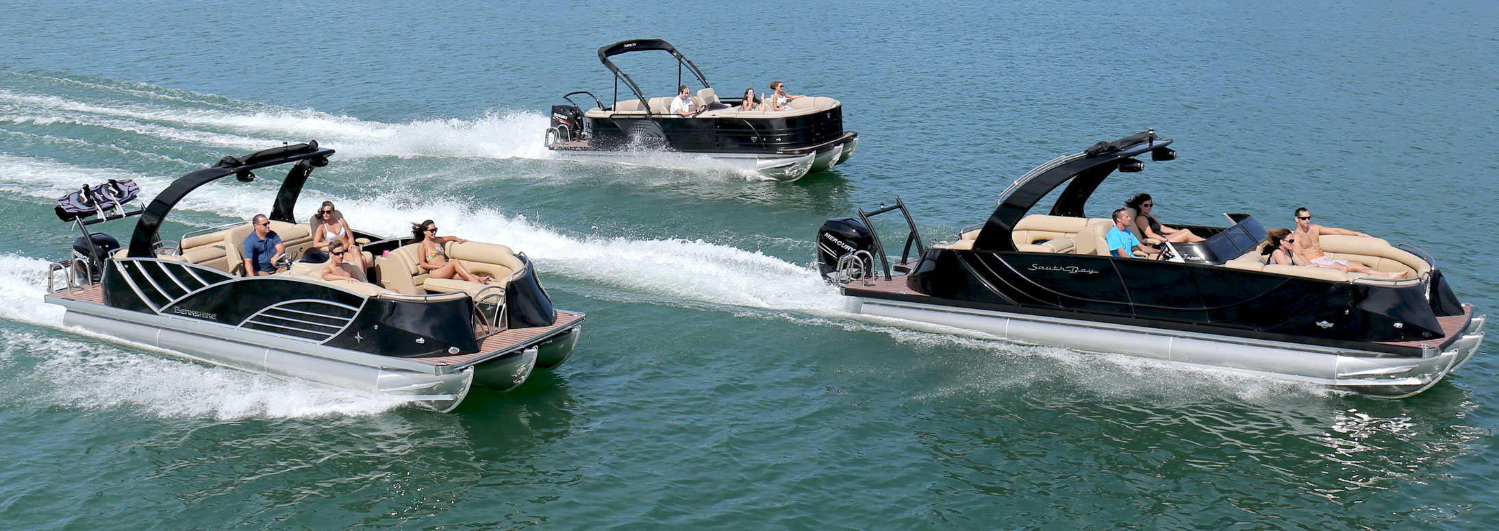 three pontoon boats out on the lake